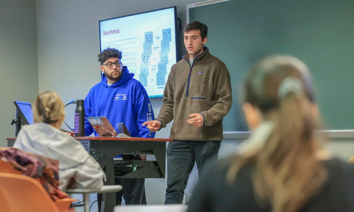 Professor and Student at a Computer