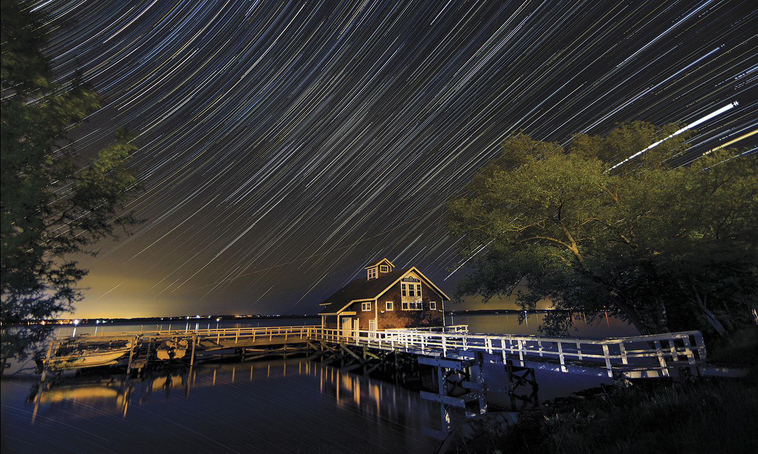 Star trails over the Bozzuto Boathouse