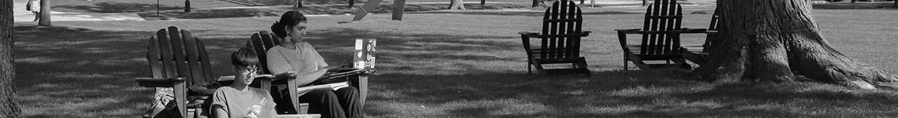 William Smith students studying in Adirondack chairs