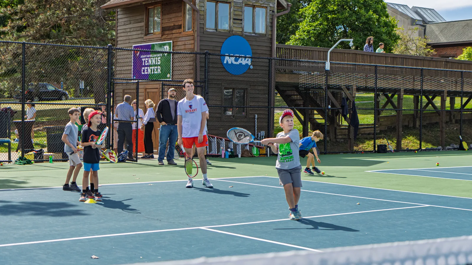 Hobart tennis student-athletes lead a youth clinic at the HWS Tennis Center