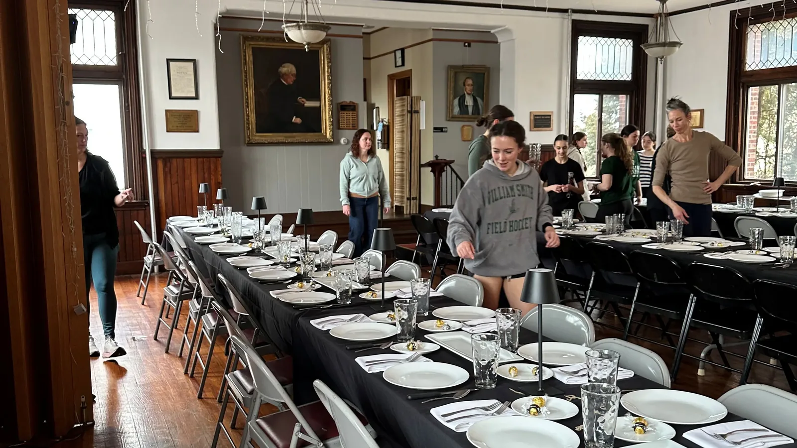 William Smith field hockey members set up for a community dinner