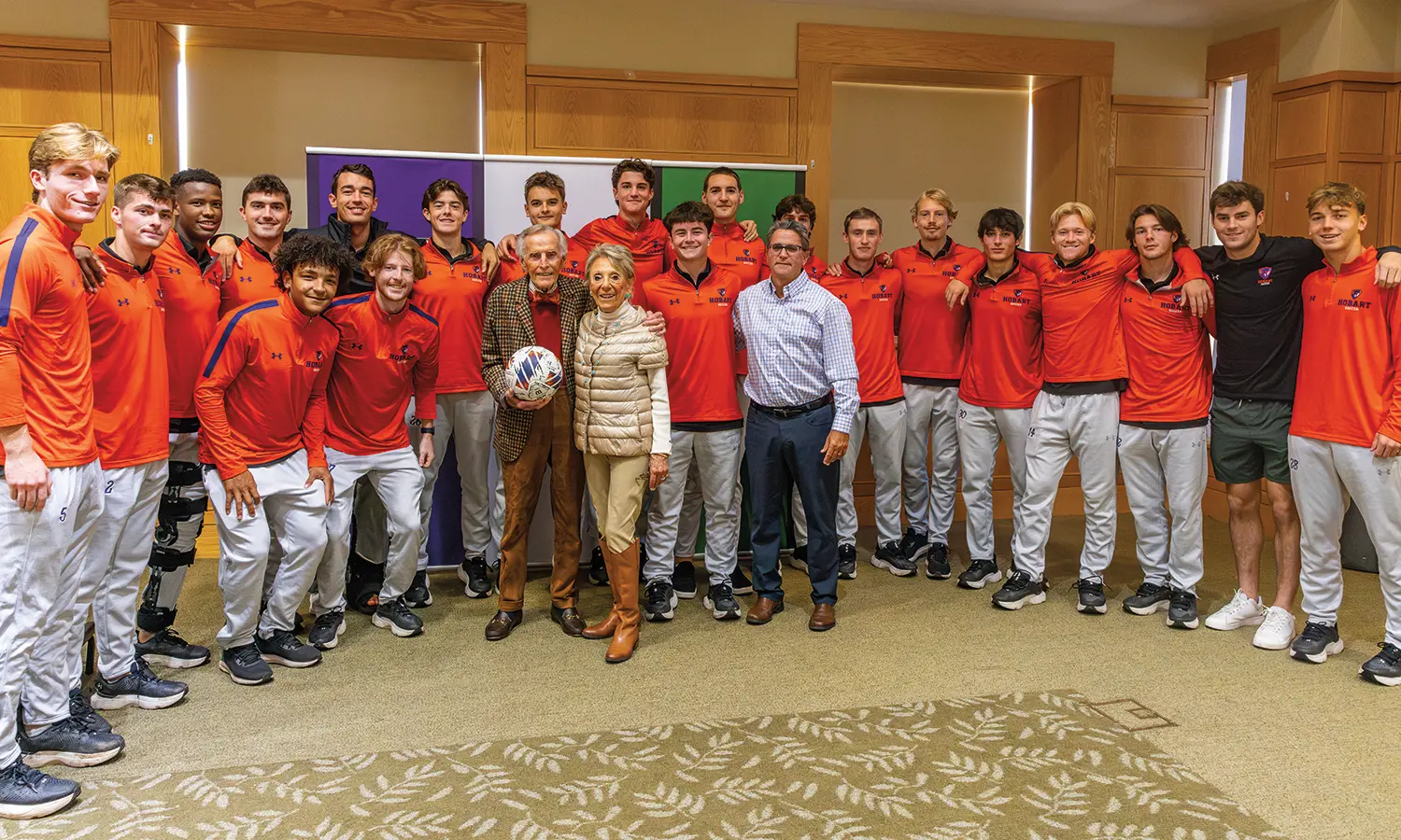 Honorary Trustee Thomas B. Poole ’61, P’91, L.H.D. ’06 and Mary Jane Poole P’91 pose for a picture with the Hobart soccer team and Head Coach Shawn Griffin P’24 before the Statesmen’s game against the Rensselaer Polytechnic Institute Engineers last fall. For more than 35 years, Tom Poole has served on the HWS Board of Trustees, for much of that time chairing the important Buildings and Grounds Committee, influencing nearly every facilities improvement with his construction savvy and design sense. Before retiring in 2019, Poole was the chairman and CEO of Hallen Construction Company, Inc., on Long Island. He joined the company in 1964, following his graduation from Hobart and his Navy service during the Cuban Missile Crisis. Under his leadership, Hallen grew to one of the most in-demand firms in New York City. Among many other career distinctions, Poole has worked on every bridge in New York City. In 1995, Poole received Hobart’s William Napier Memorial Award for outstanding service to Hobart Athletics and the SAA. He received a citation from the Hobart Alumni Association in June 1986 and was inducted into the Hobart Statesmen Hall of Fame in October 2002. In 2006, he was honored by Hobart and William Smith with an honorary degree. The Pooles—who are the parents of Shep ’91, Wendy, Leslie and Stacey—are inaugural members of HWS’ Seneca Society, which recognizes those individuals whose philanthropy to HWS exceeds $1 million.