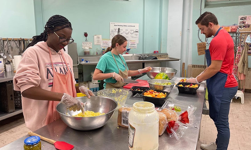 Students prepare lunch at the Community Lunch Program