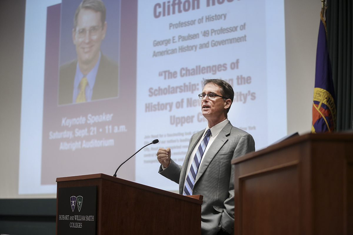 Hood speaks at a podium