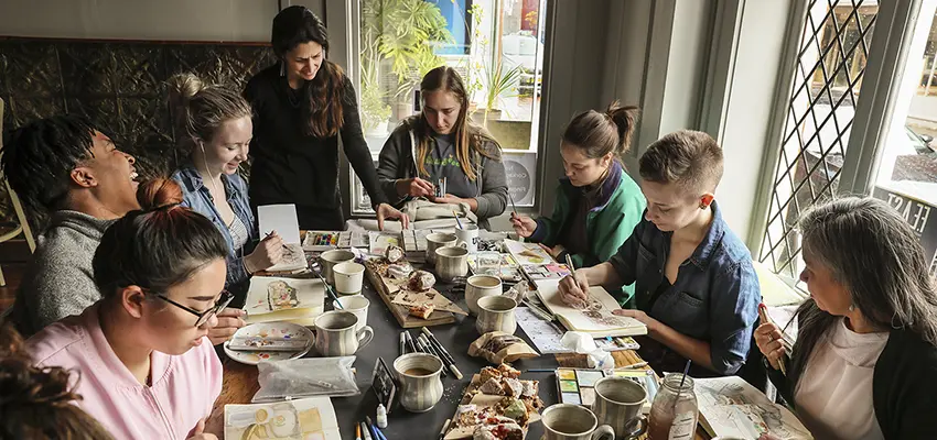 Professor Makker holds an art class at a downtown restaurant.