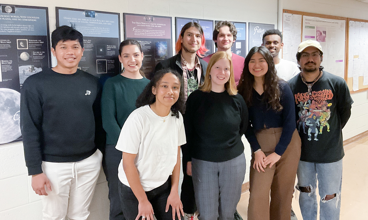 The nine student participants in the 22nd annual Albert Holland Physics Lecture Competition gather for a photo in Eaton Hall on Thursday.