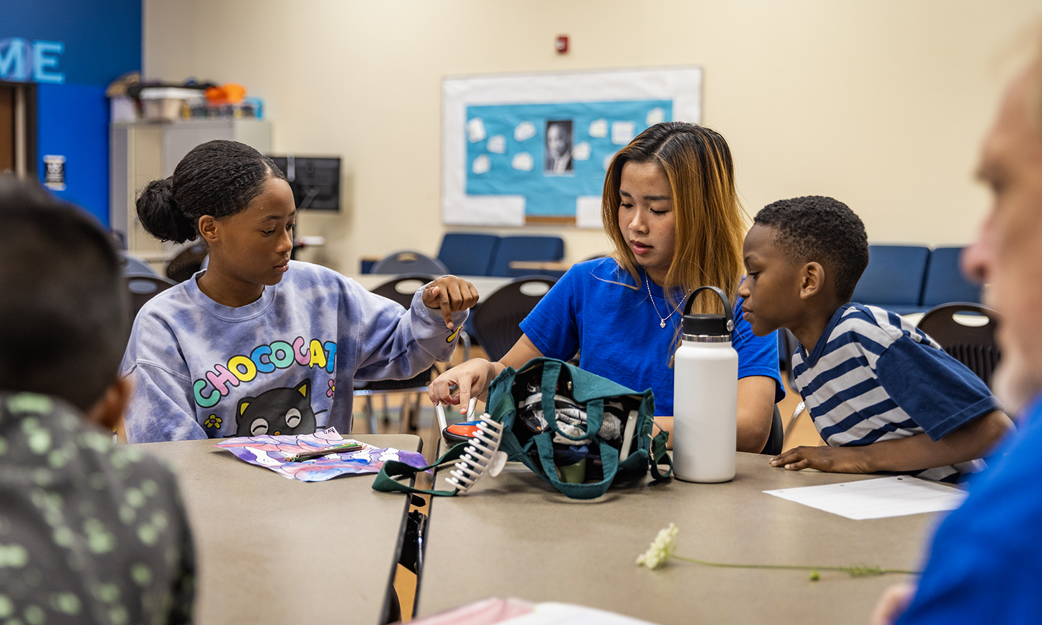 Tutor at table with students