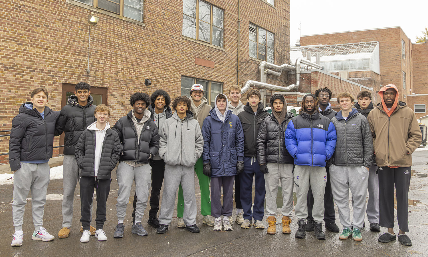 Hobart basketball players pose for a picture before clearing out Eaton Hall.