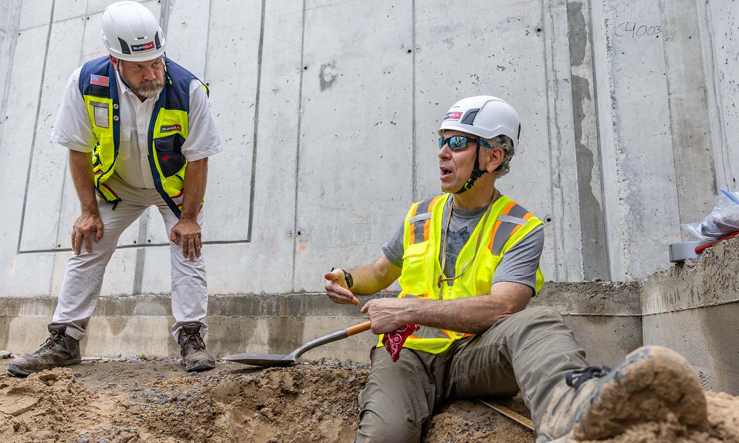 Suffolk Construction Senior Superintendent Steve Bell looks at sediment samples with Associate Professor of Geoscience David Finkelstein.