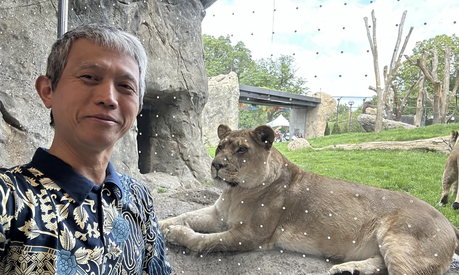 Associate Professor of Religious Studies Shalahudin Kafrawi takes a selfie with a conference observer at the zoo. 