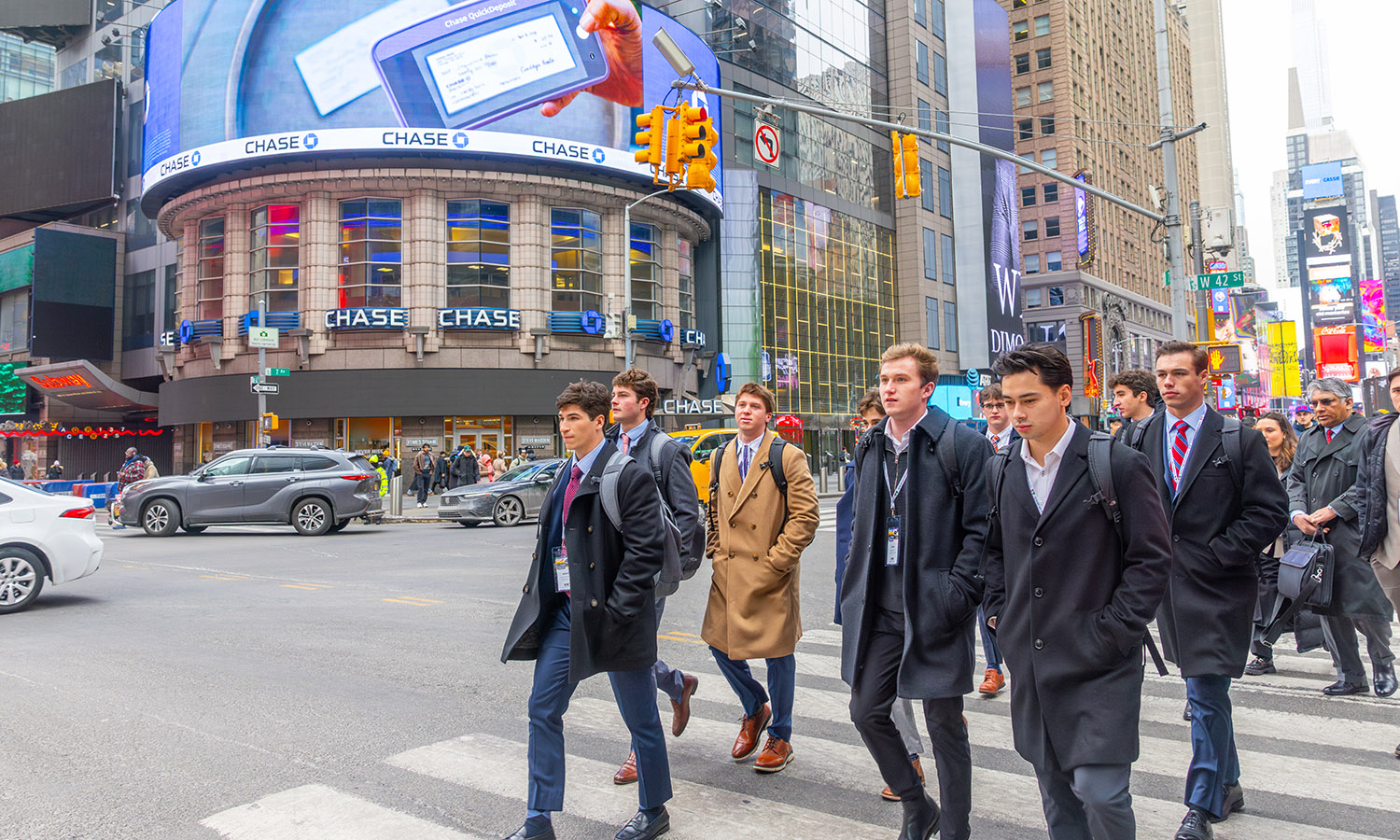 Students walk near Times Square in New York City.