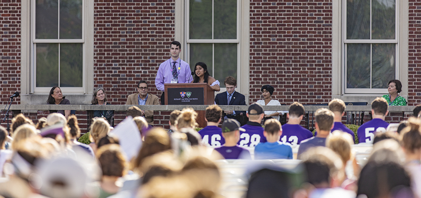 Ethan and Litzy speak to the audience