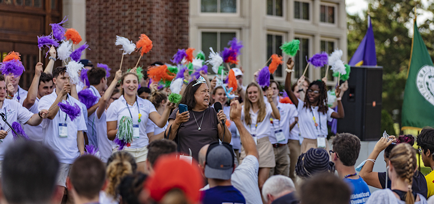 President Jacobsen sings to the audience