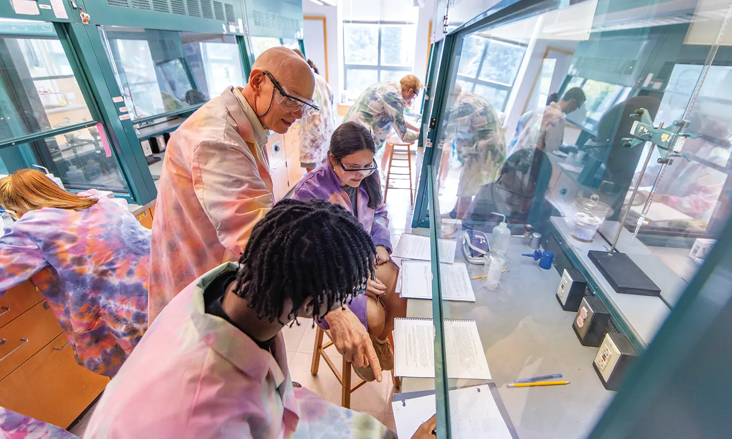 Professor of Chemistry Walter Bowyer works with Sam Ansah ’28 and Sidonie Murphy ’28 on a lab activity during “New Chemistry Meets Old Art,” a first-year seminar that explores the many points of contact between art and science.