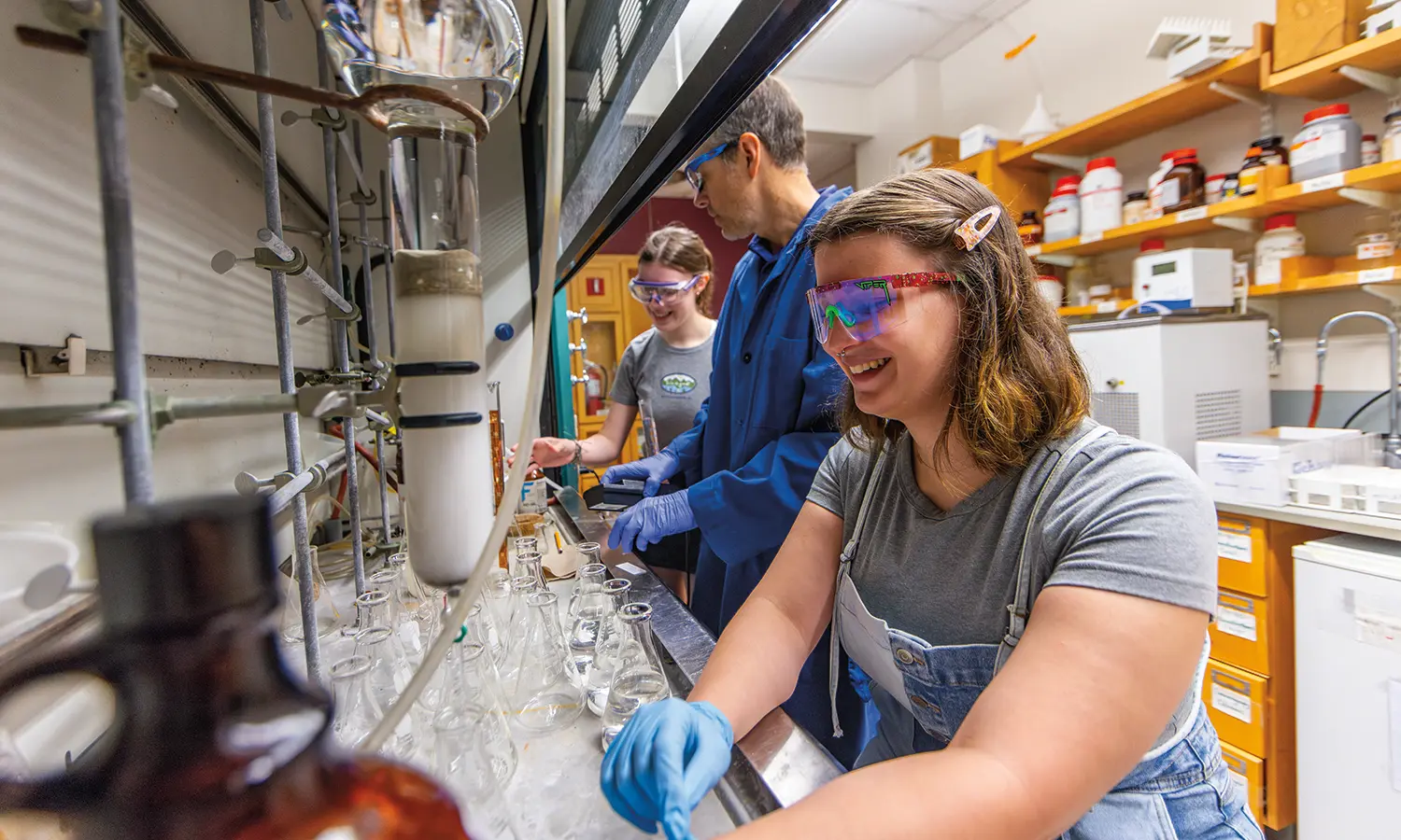 With Professor of Chemistry Erin Pelkey, Keira Potvin ’26 works up a reaction using a liquid-liquid extraction while Merrelle Grillo ’26 uses flash column chromatography to purify anti-cancer pre-cursor.
