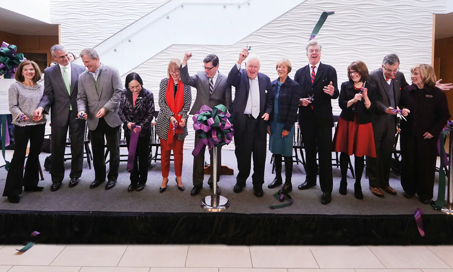 In the L. Thomas Melly ’52, L.H.D. ’02 Lobby, a joyful group of HWS community members including Tom and Judy Melly (center) cut the ribbon on the new Performing Arts Center.