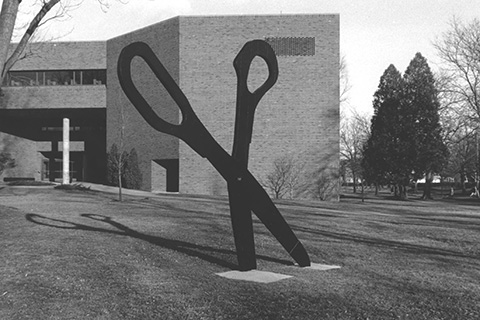 Exterior of the library with the Scissors sculpture, undated but taken some time before the addition of the Melly Center in the late 90s.