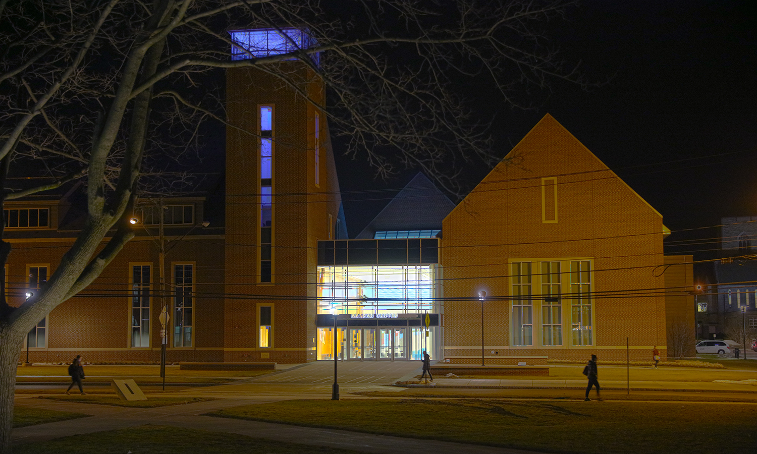 Students walk by an i